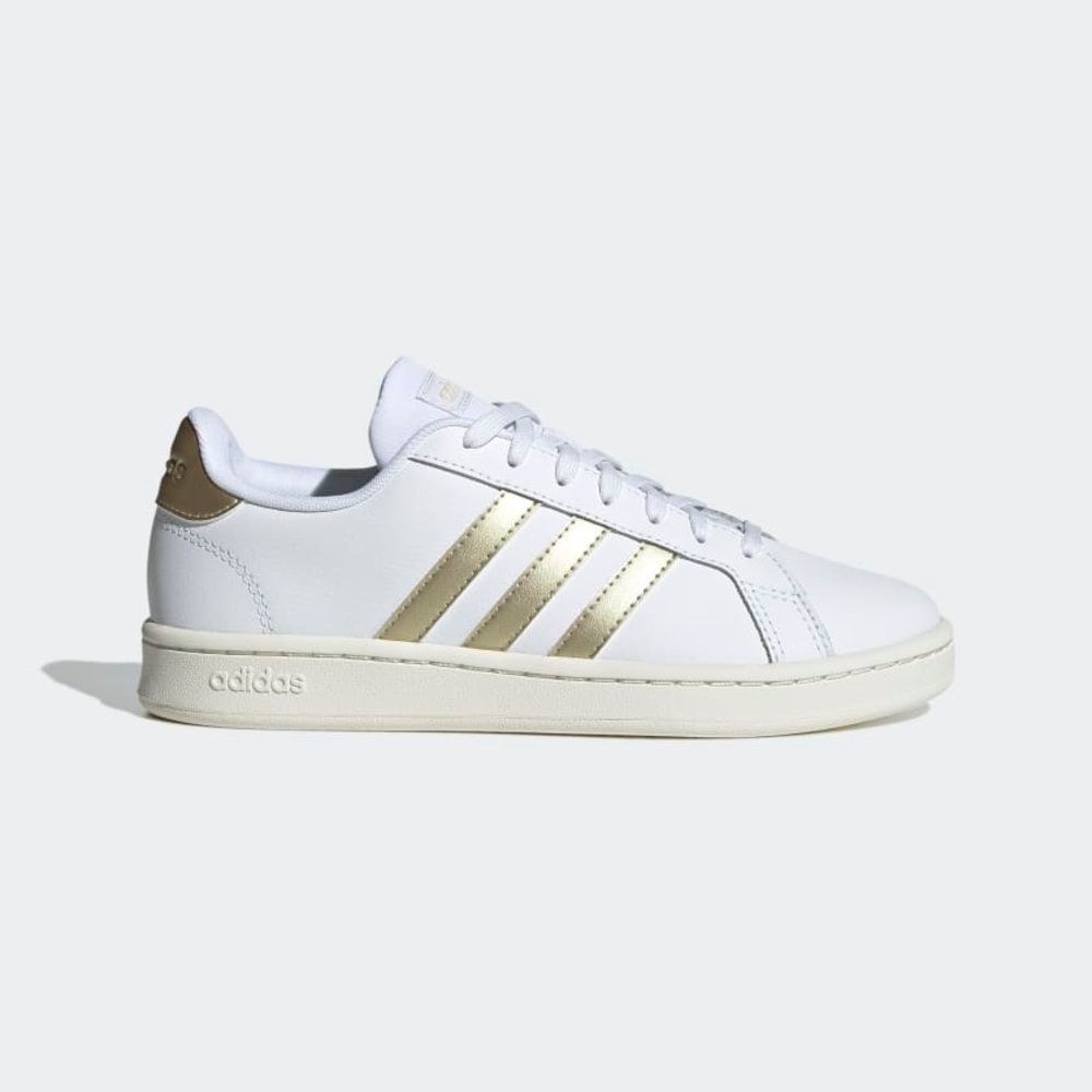 Adidas White Sneakers with Gold Stripes